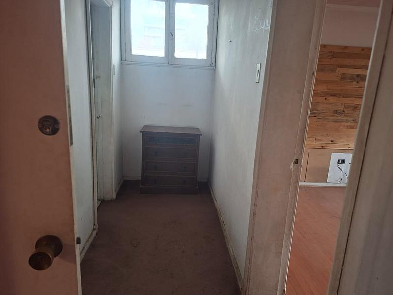 Gran Terreno de 611 m² en Barrio Simón Bolívar, Ñuñoa | Sólida Casa Familiar con Enorme Potencial