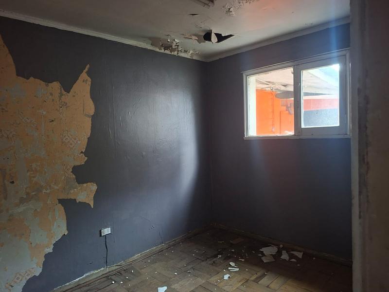 Gran Terreno de 611 m² en Barrio Simón Bolívar, Ñuñoa | Sólida Casa Familiar con Enorme Potencial