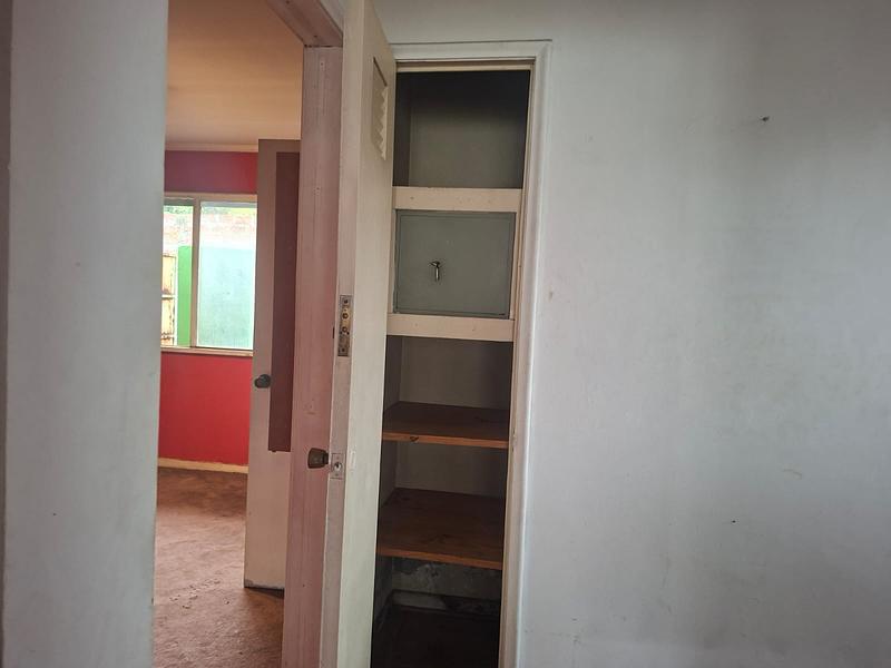 Gran Terreno de 611 m² en Barrio Simón Bolívar, Ñuñoa | Sólida Casa Familiar con Enorme Potencial